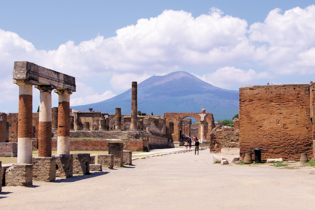 Ruins of Pompeii with mountains in the background